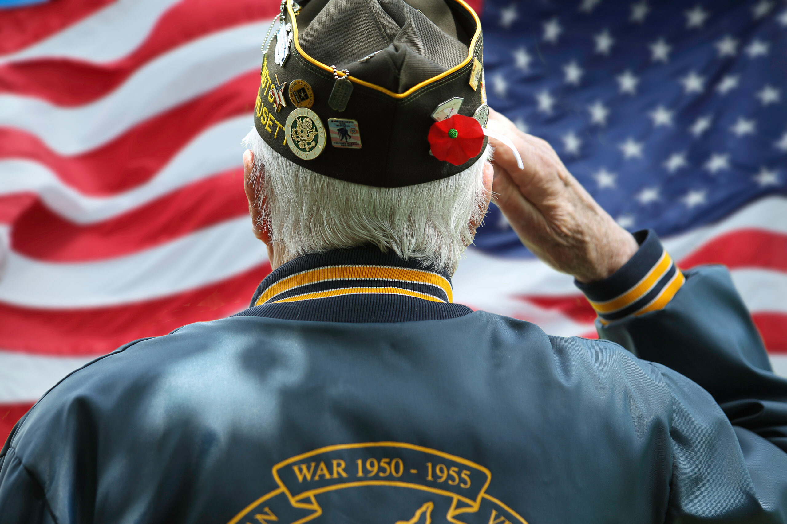 honoring our fallen heros, veteran saluting the american flag