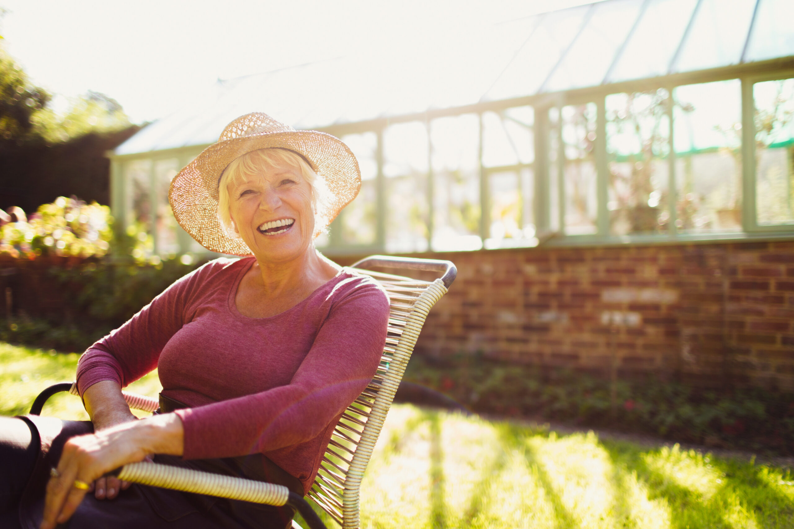 senior activities in summer, woman smiling with the sun shining